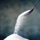Sugar pouring from spoon